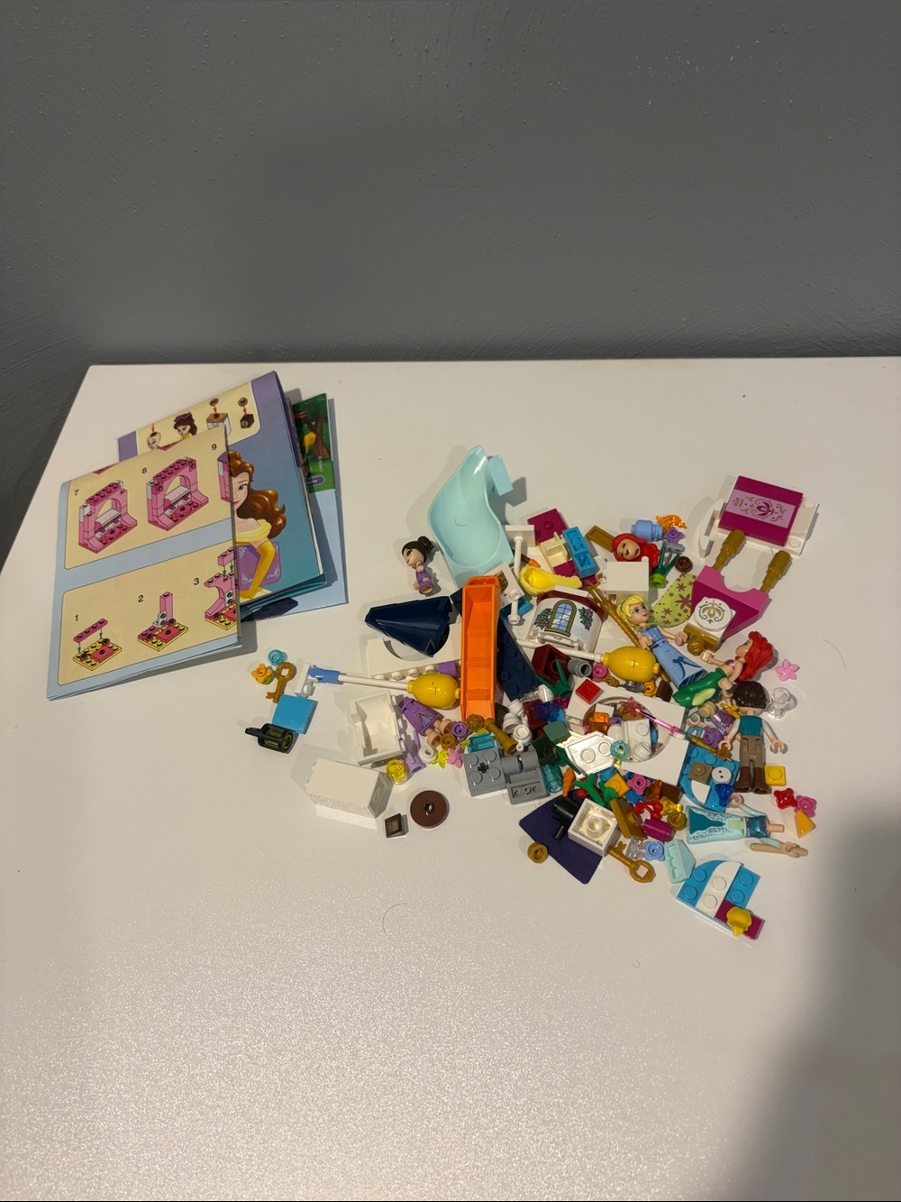 LEGO Miscellaneous small pieces, figures, and pamphlets lot most Disney